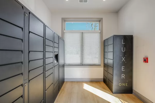 A mailroom equipped with Luxer One smart lockers